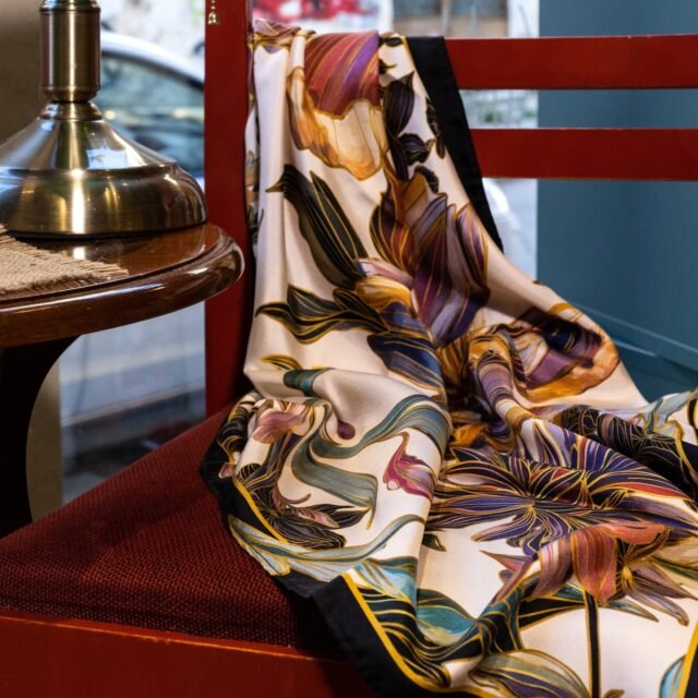 Petal Whisper
This luxurious silk scarf features an array of oversized, intricately detailed flowers in deep purples, soft pinks, and warm golds, complemented by touches of teal and olive green. Framed by a sleek black border, the Petal Whisper Silk Scarf beautifully blends nature’s artistry with sophisticated style. Crafted from 100% Silk Twill, it’s an elegant, wearable garden for every occasion.
Drawn by hand, made in Greece.
Free delivery worldwide via #dhl 
Packed in a gift box.

#fetolia #silkscarf #handmade #scarf #elagant #greekart #giftsforalloccasions #giftsforher #womansday #internationalwomensday #giftidea #happywithfetolia @simoun.books.and.coffee @mary_paraskevopoulou_